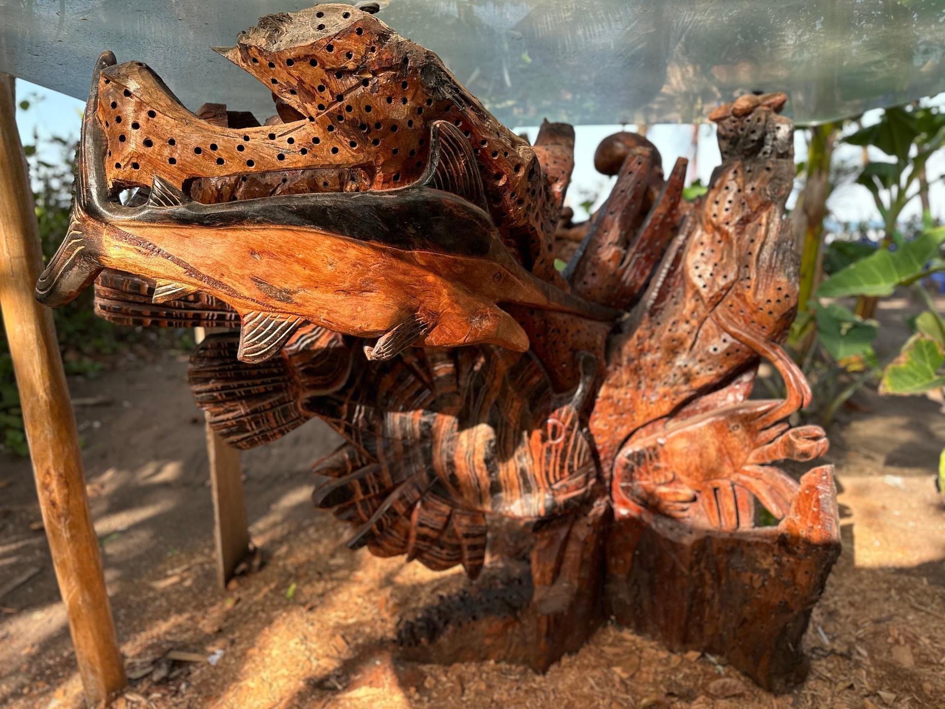 Marine life wood sculpture with fish and sea creatures