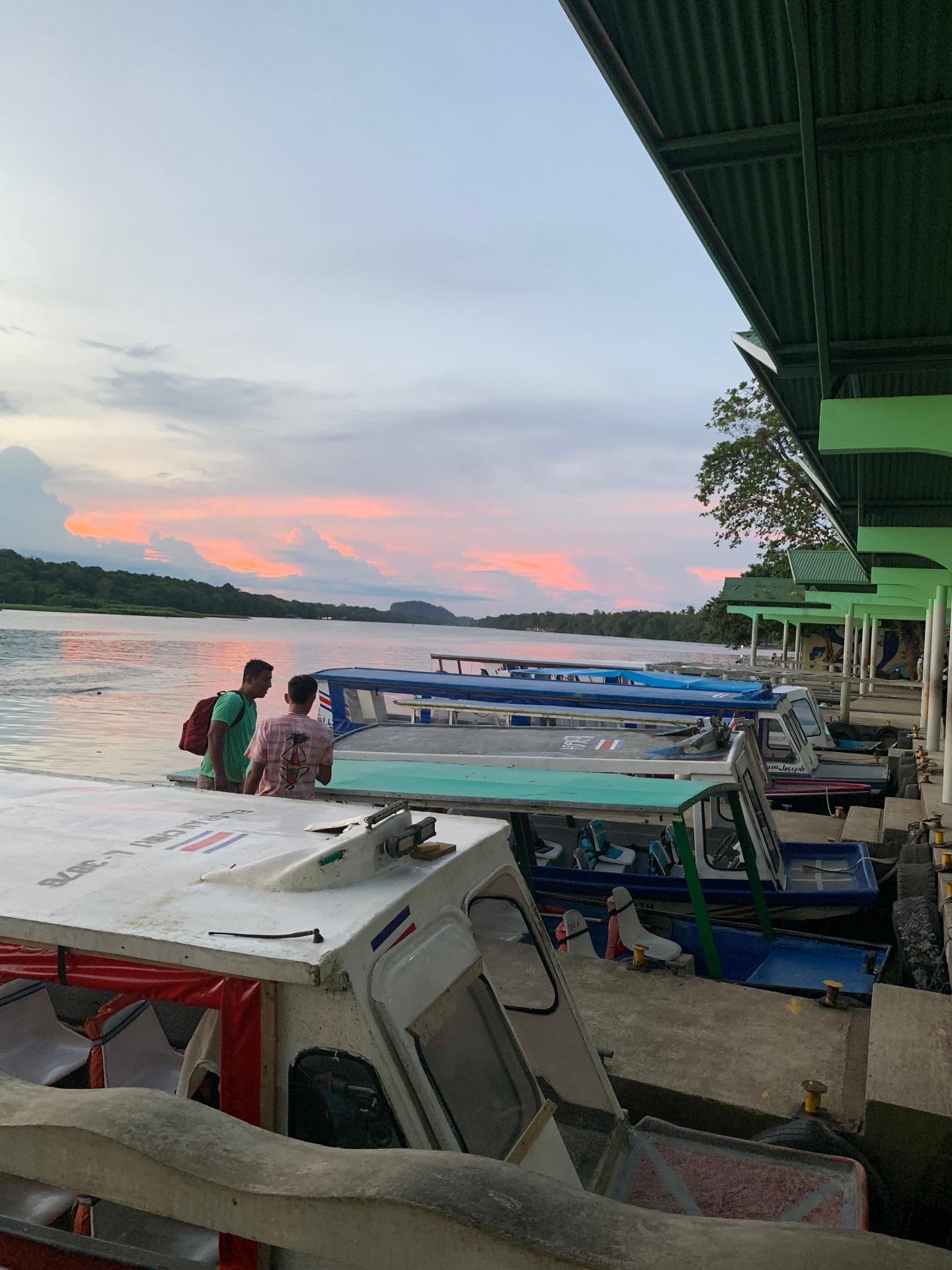 Local boats at sunset on Tortuguero river dock
