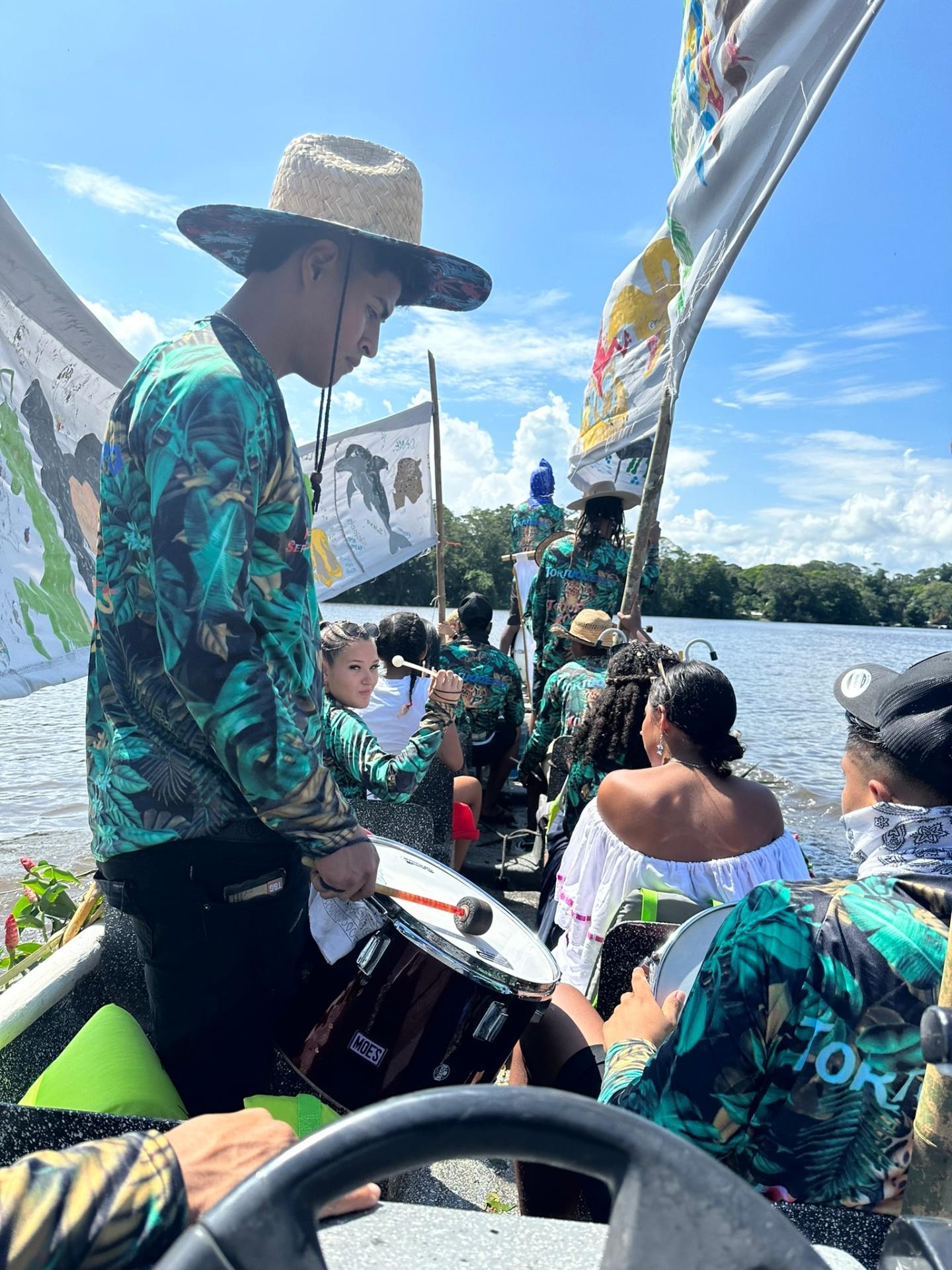 Local boat festival with drummers on Tortuguero river